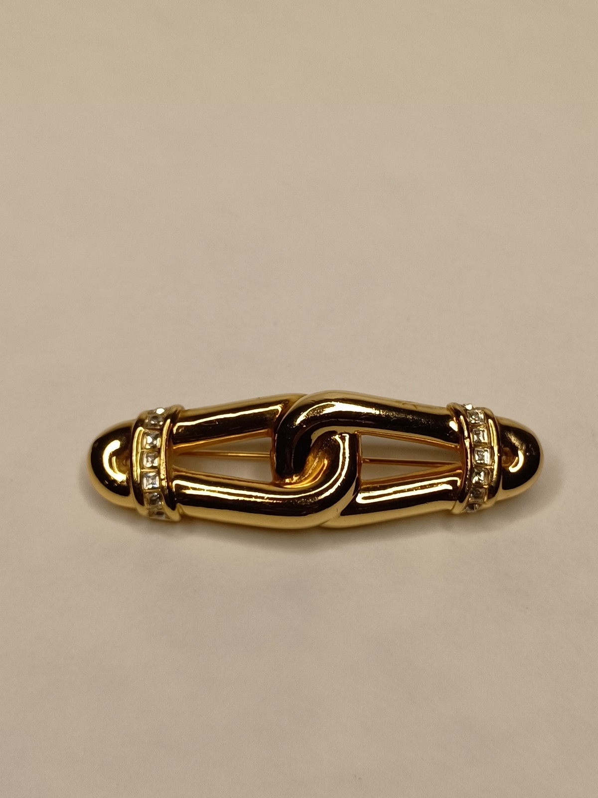 Christian Dior 1980's Gold-plated Crystal Pave Love Knot Brooch