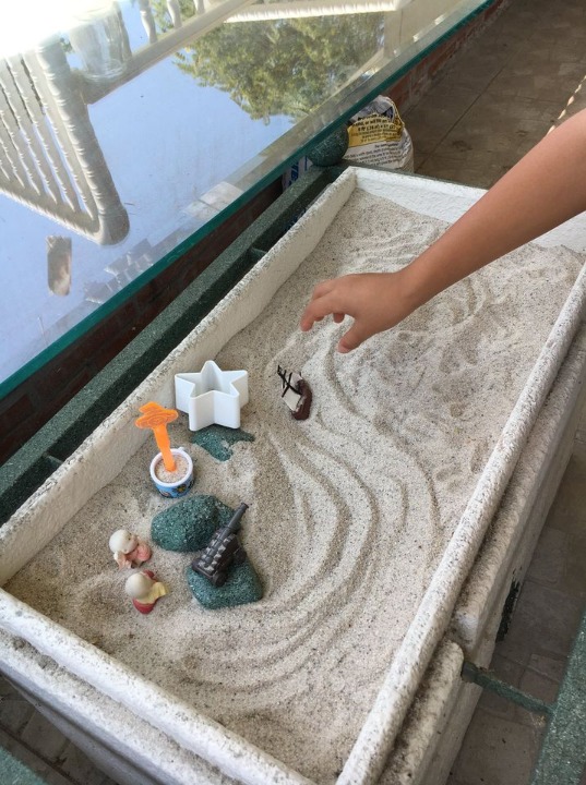 Glass-top Sandbox Table in living room or patio