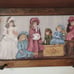 Vintage wood crafted wall shelf with pegs and a Victorian themed period print