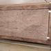 Vintage wood crafted wall shelf with pegs and a Victorian themed period print