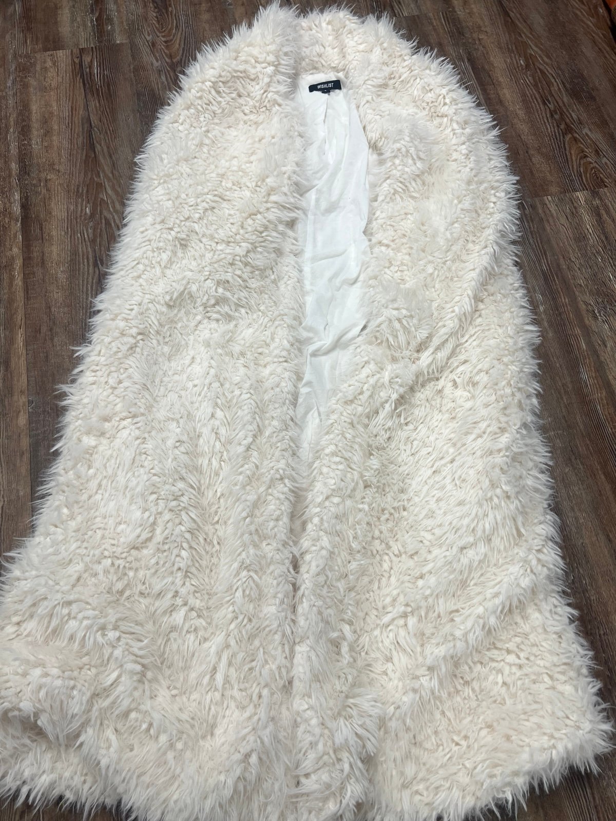 White faux fur long vest would be super cute for a festival or rave
