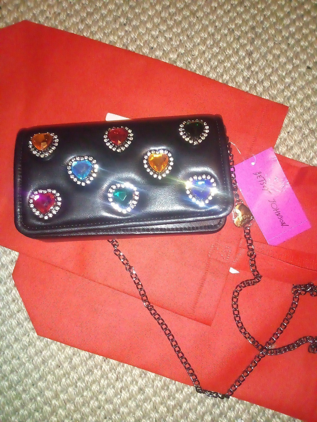 Betsey Johnson - Black purse with colored heart stones on the front.