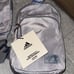 NWT, Adidas gray/ blue stone sling bag.
