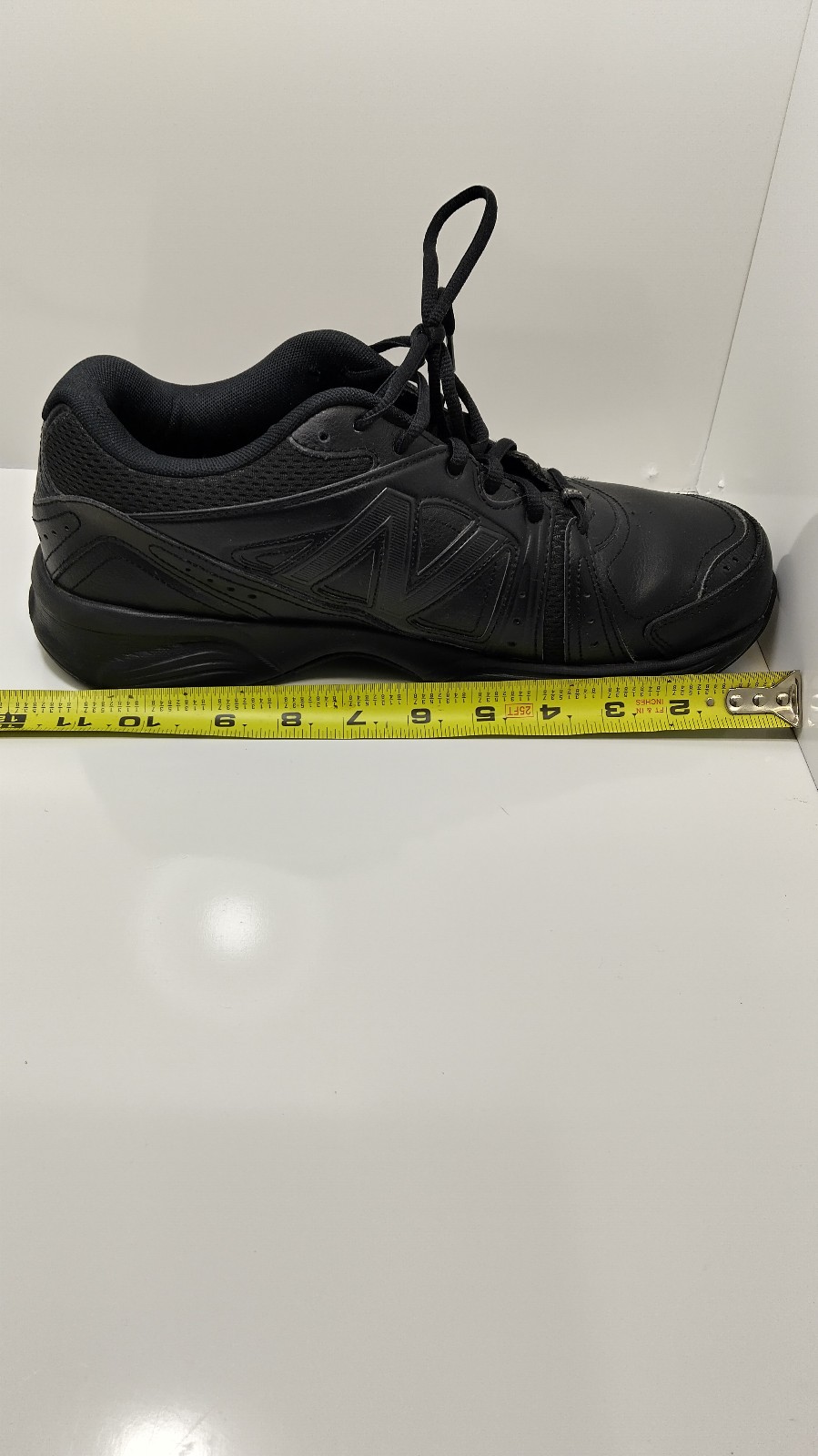 Used New balance 519 size 9 black tie sneakers absorb soul.