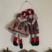 Hanging Raggedy Ann and Andy