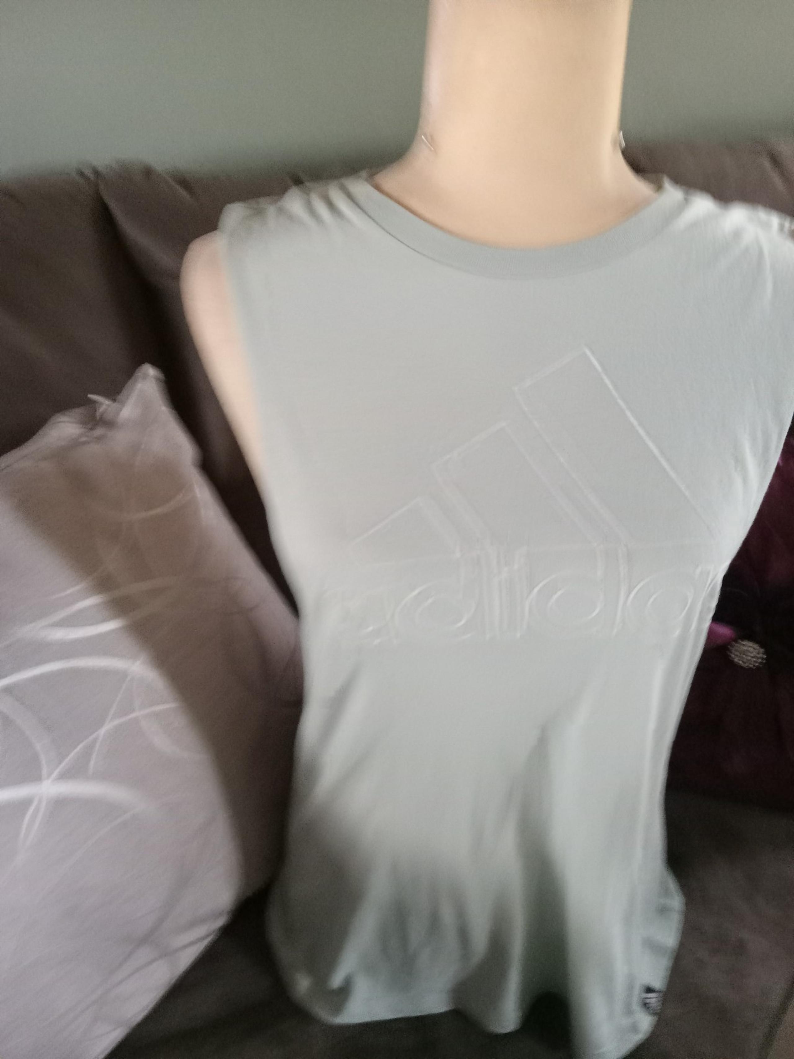 Adidas sleeveless top with open sides. Light green, excellent condition