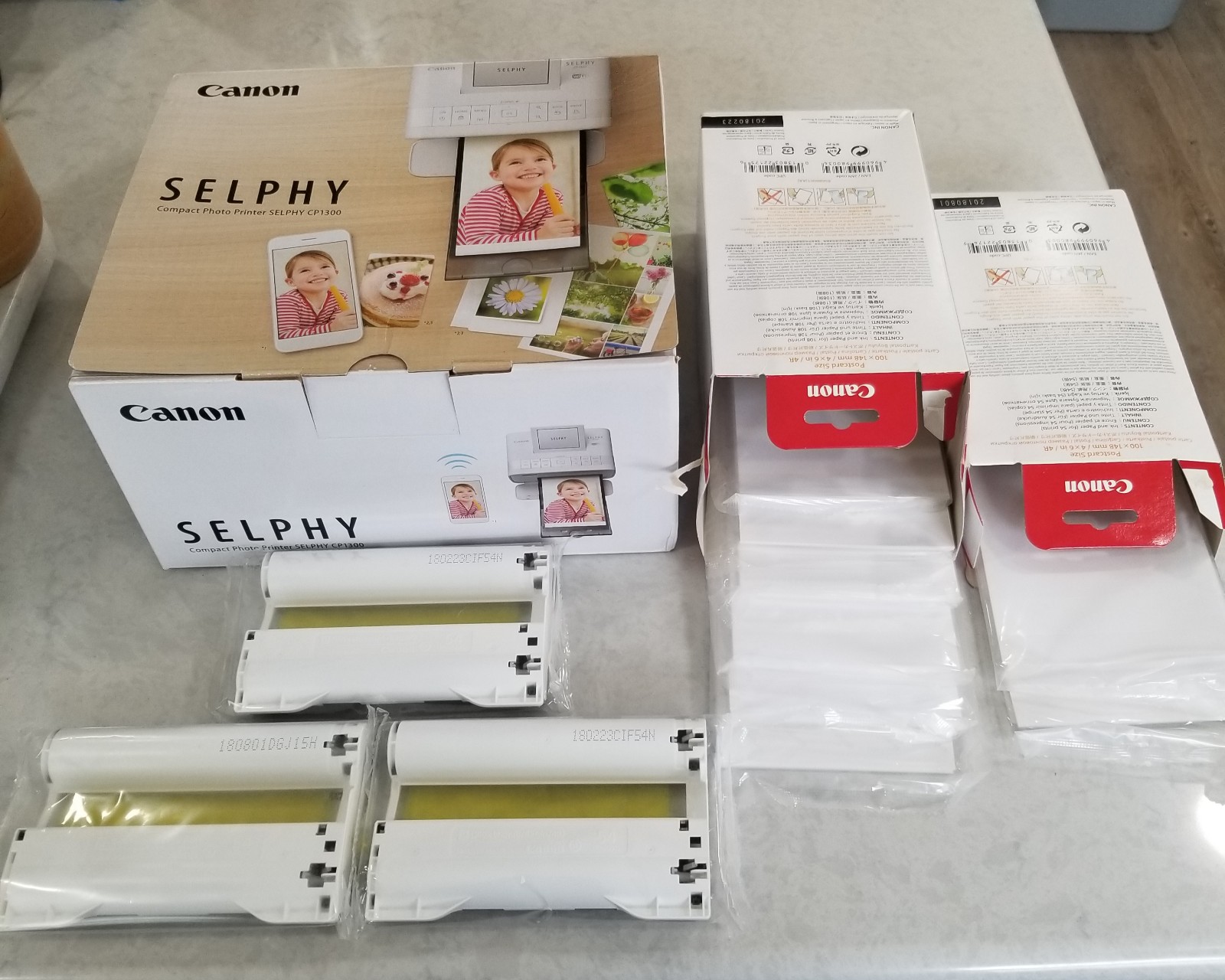 Canon selphy cp1300 white with extra photo paper new open box
