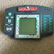 Hand held monopoly game