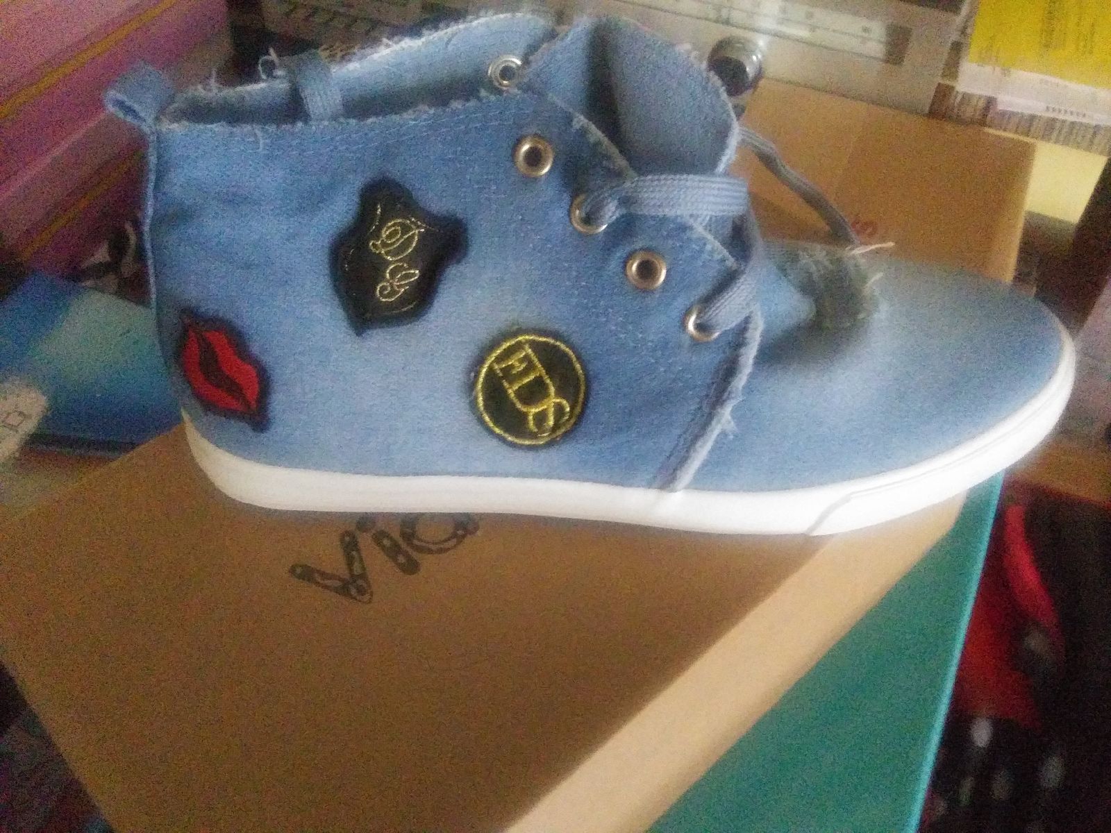 Denim high top tennis shoes.