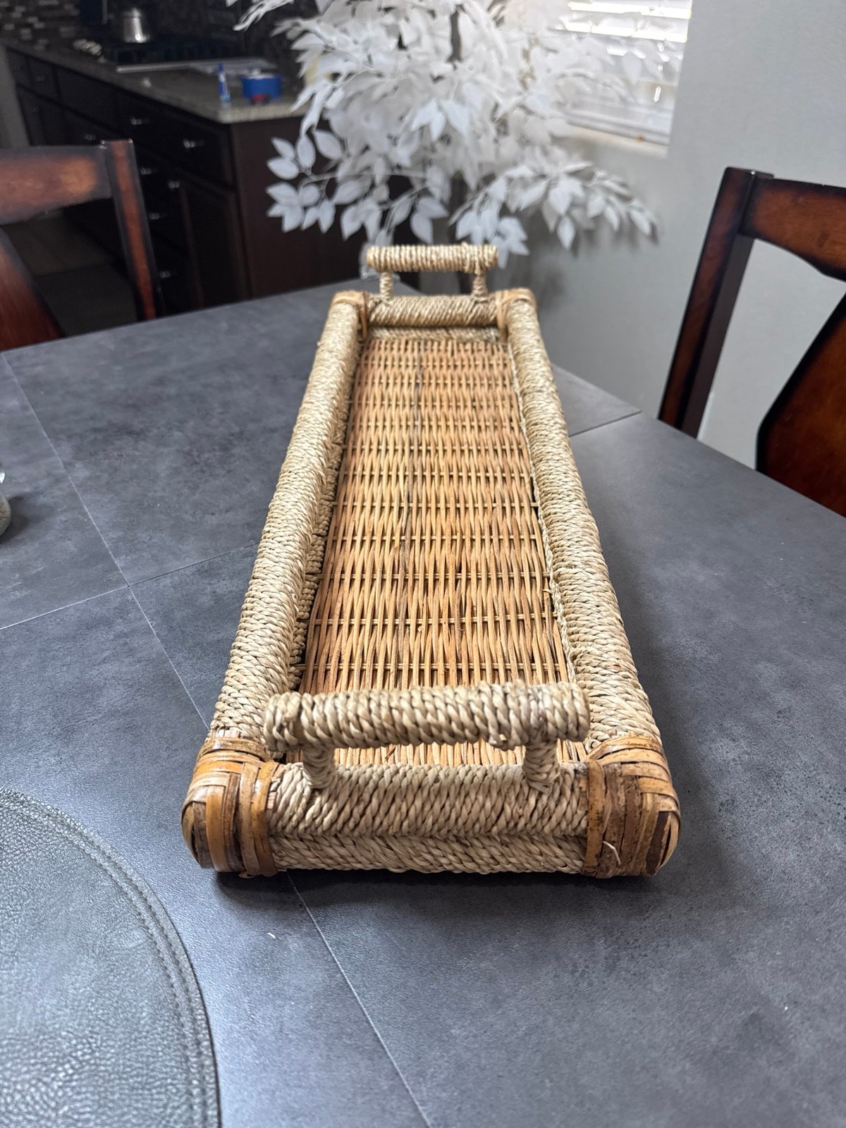 Abaca rope woven over pole rattan frame and handles with rustic cane basket