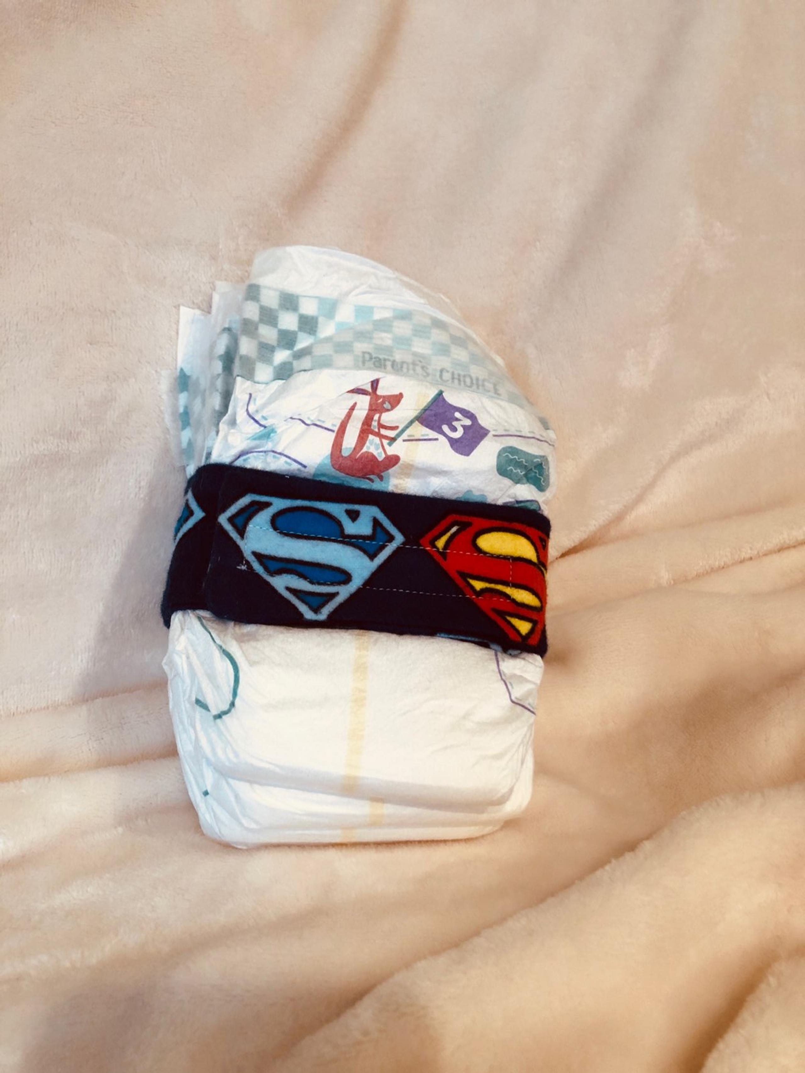 Super man diaper strap