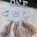 One letters, one cake topper, high chair decor and onsie (onsie never worn)