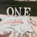 One letters, one cake topper, high chair decor and onsie (onsie never worn)