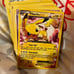 Pokémon Card Lot Of 75 Mixed Series, 2 Coins, And The Card Holding Binder