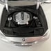 silver 1:18 scale model of a BMW 5 Series 550i (F10) By Norev