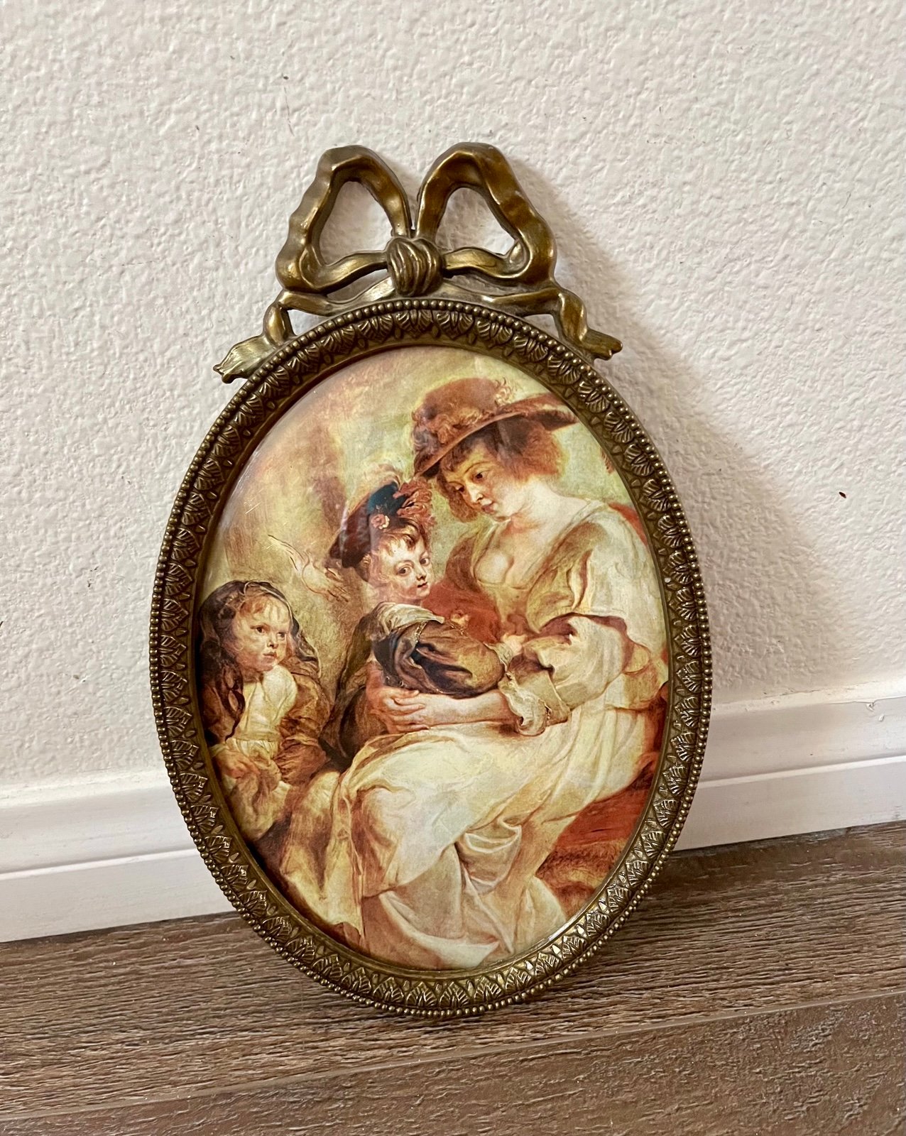 Vintage Oval Framed Art with Bow Accent