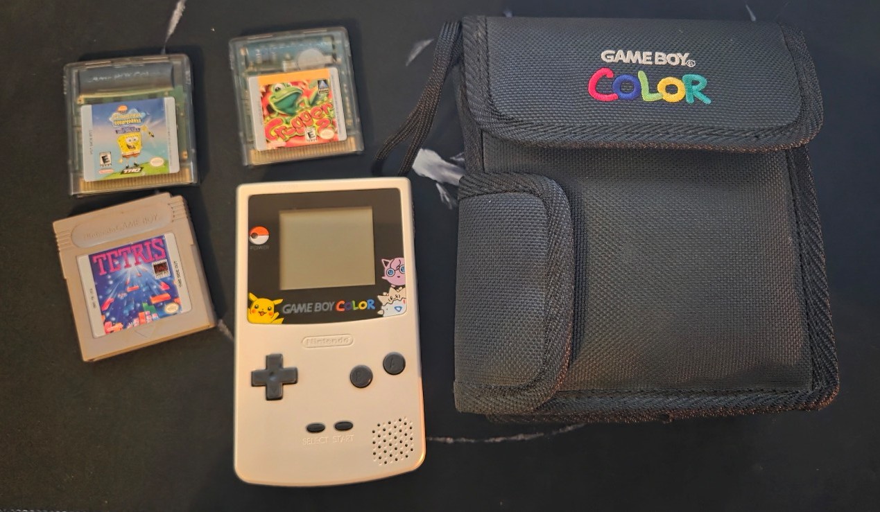 Gold Gameboy Color w/ carry bag and a few games.