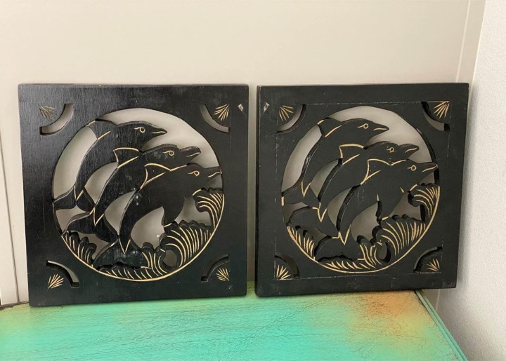 Pair of Black Solid Carved Wood Dolphins
