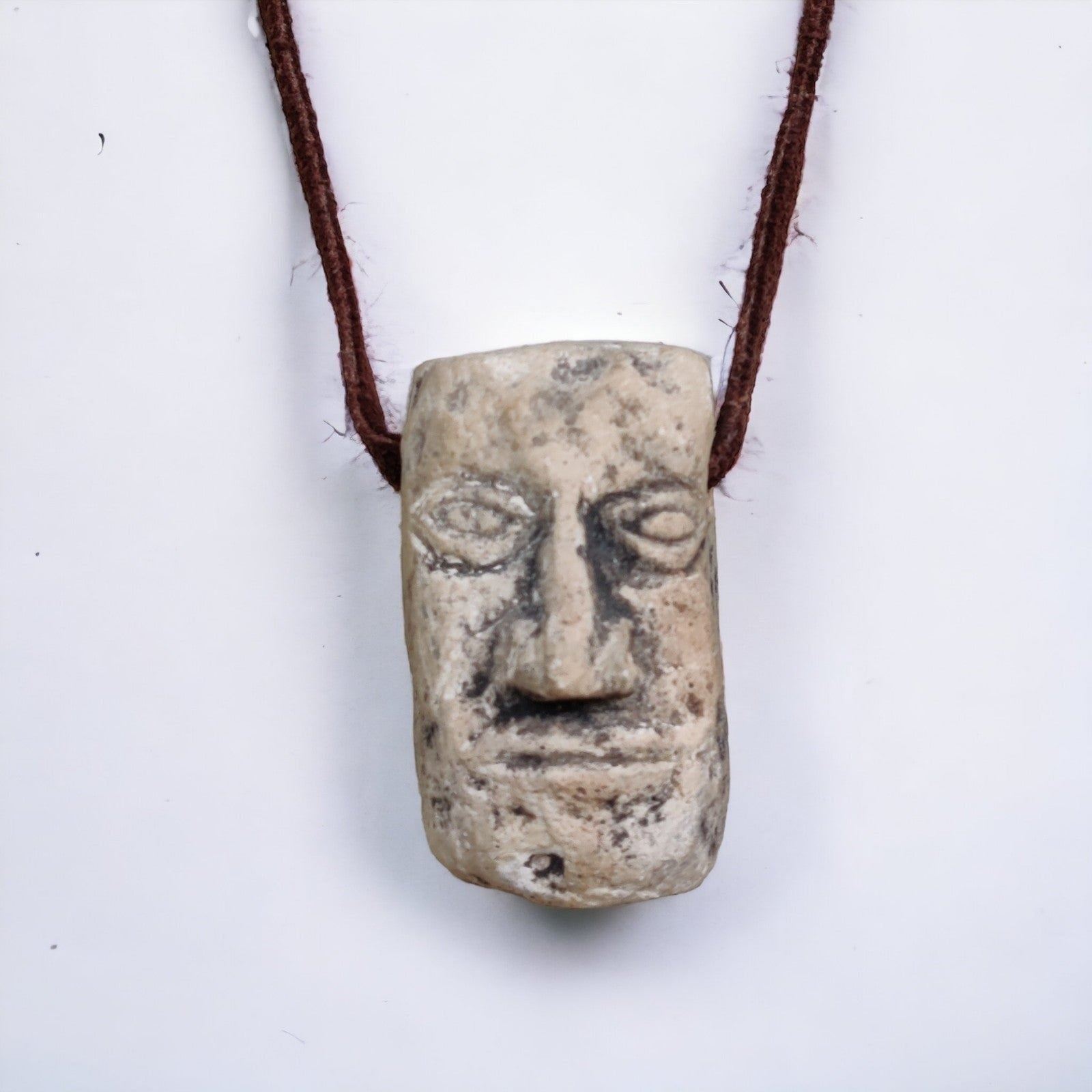 Antique carved stone face necklace