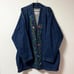 Vintage floral embroidered denim jacket purchased from a thrift store.