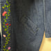 Vintage floral embroidered denim jacket purchased from a thrift store.