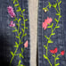 Vintage floral embroidered denim jacket purchased from a thrift store.