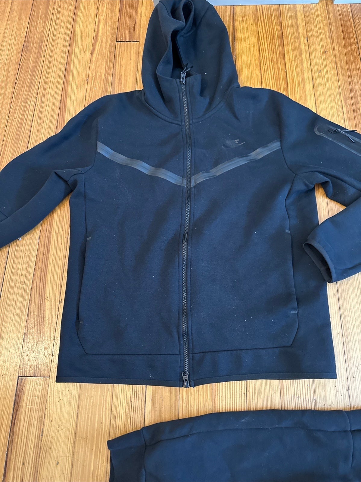 black Nike tech and pants