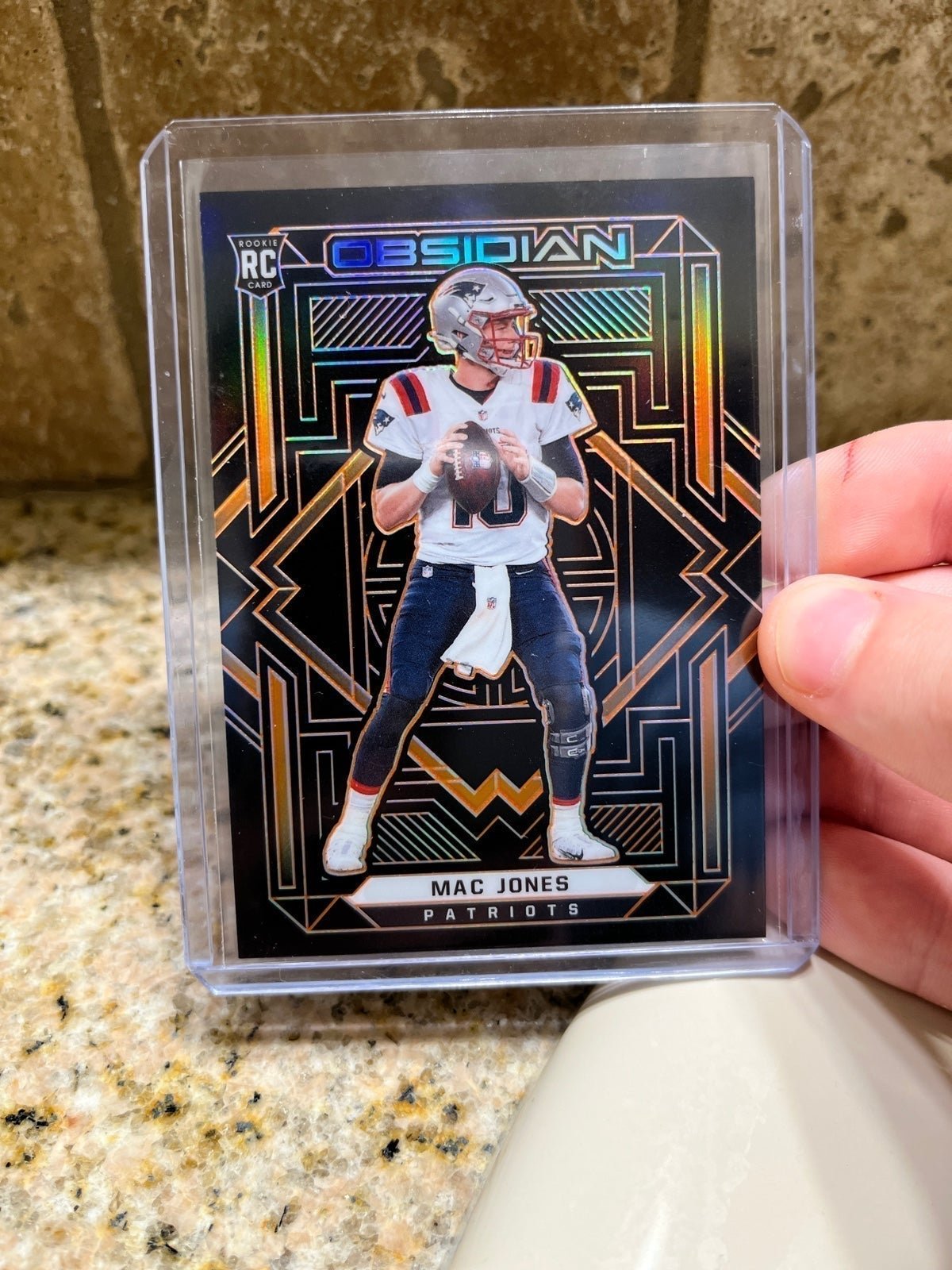 Mac Jones 2021 Obsidian Football Rookie Orange Prizm Parallel #64/75 Patriots