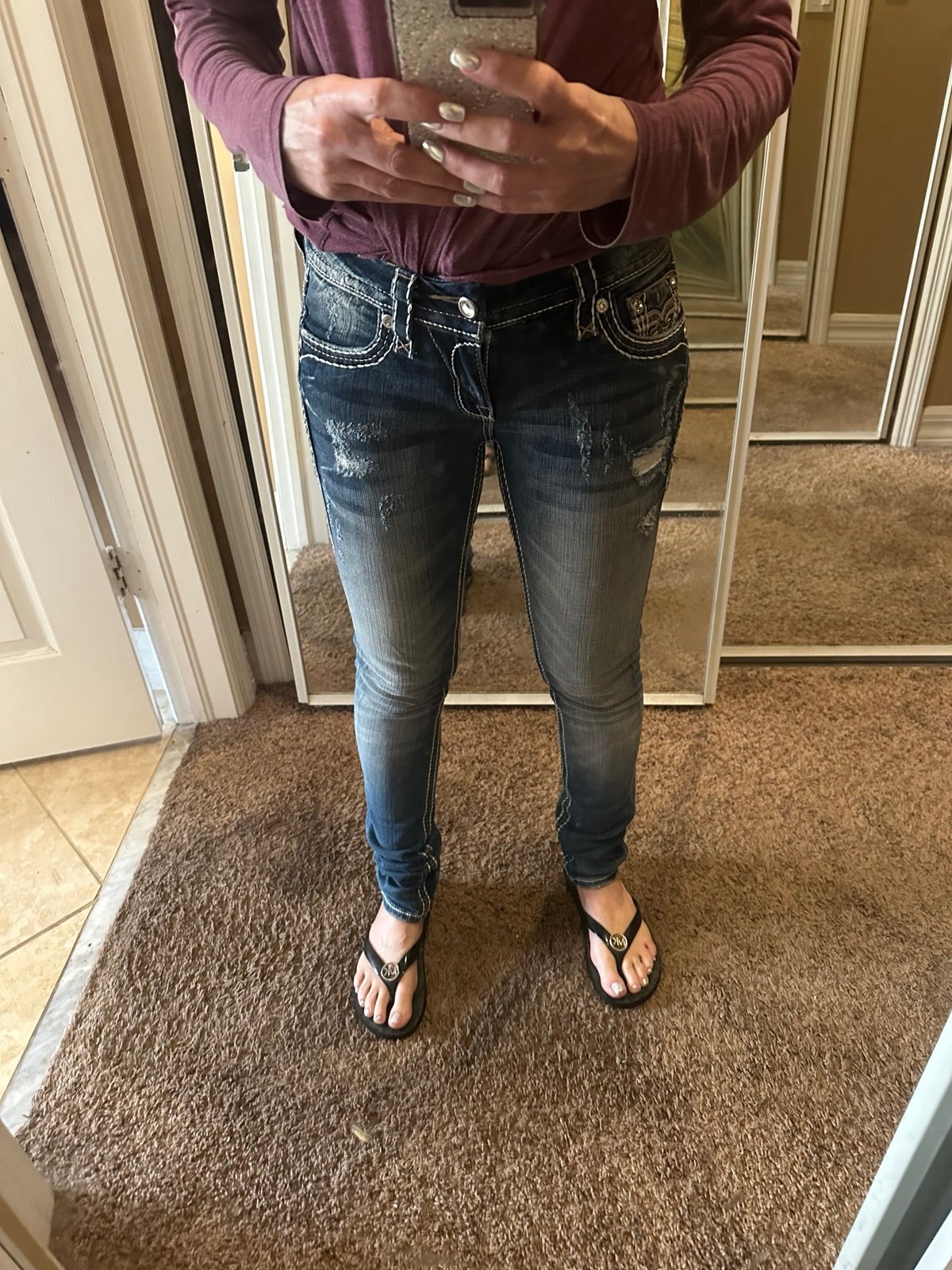 Rock Revival Women’s mid-rise skinny jeans.