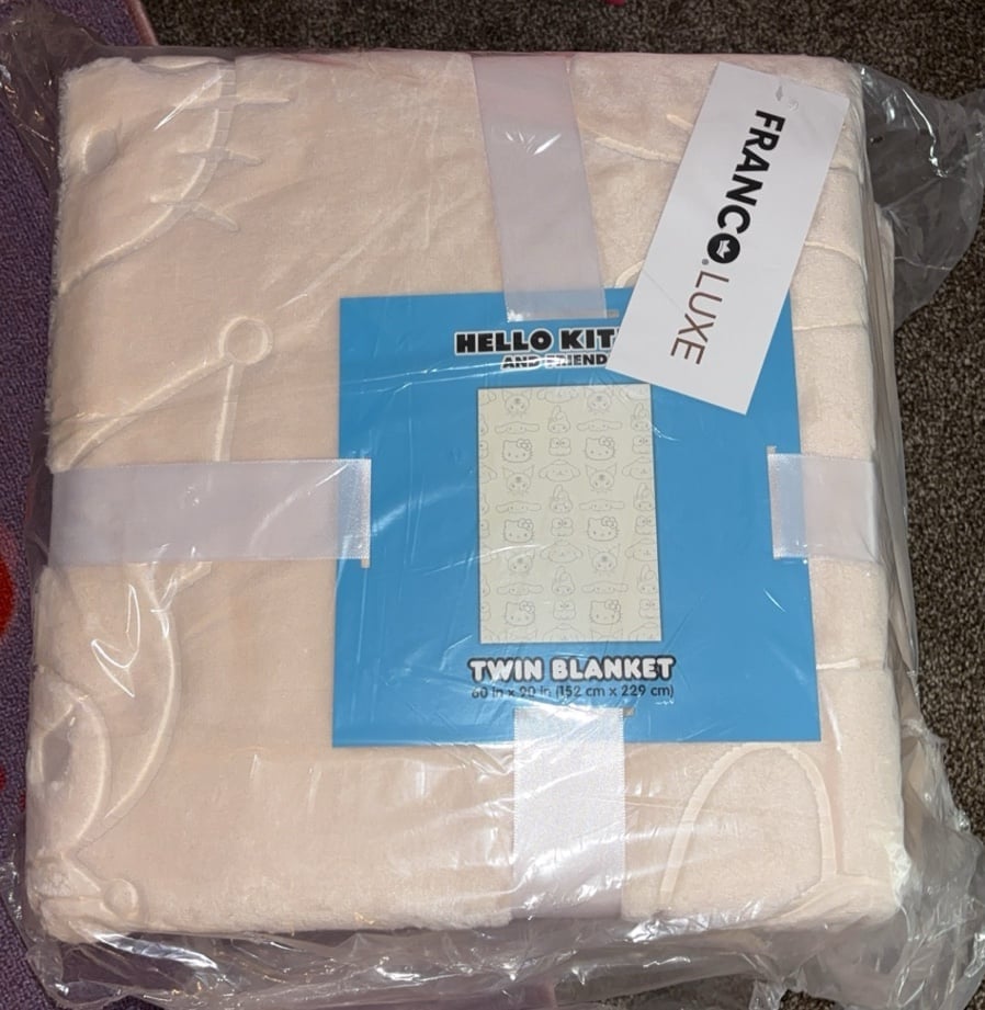Hello kitty embossed tan twin