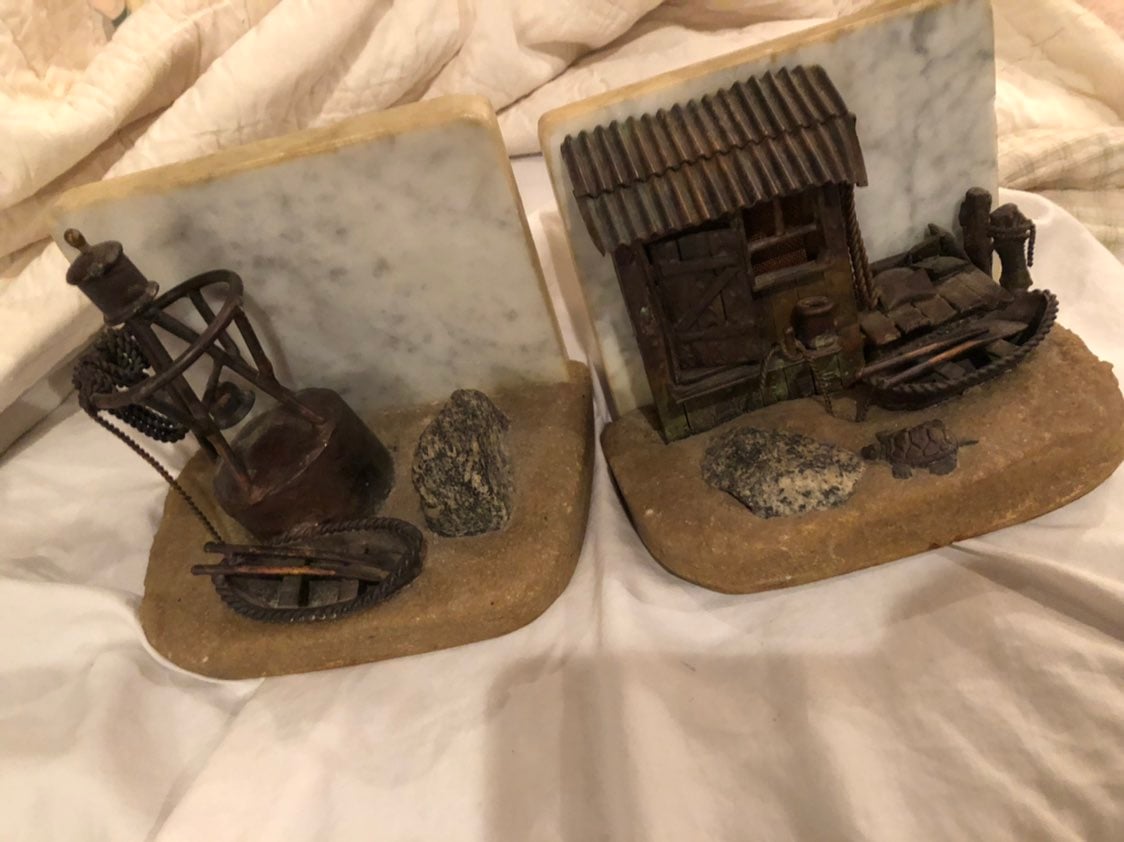 Vintage artisan made naitical bookends; marble backs granular forned bases with