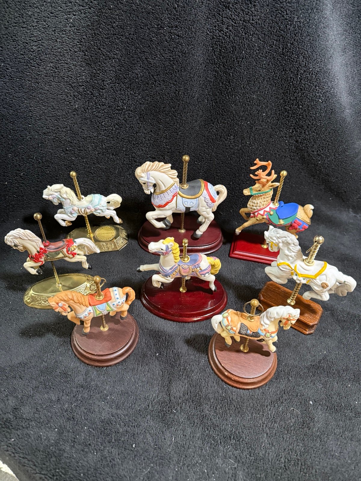 8 Various Porcelain Carousel Horses and A Reindeer