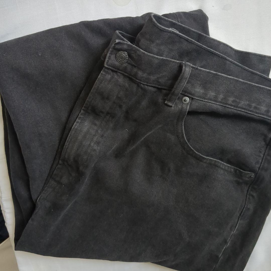 Black bootcut denim wide-leg pants, 40 inches.