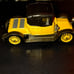 Black and yellow old-timey Corgi classic car