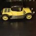 Black and yellow old-timey Corgi classic car