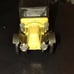 Black and yellow old-timey Corgi classic car