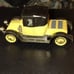 Black and yellow old-timey Corgi classic car