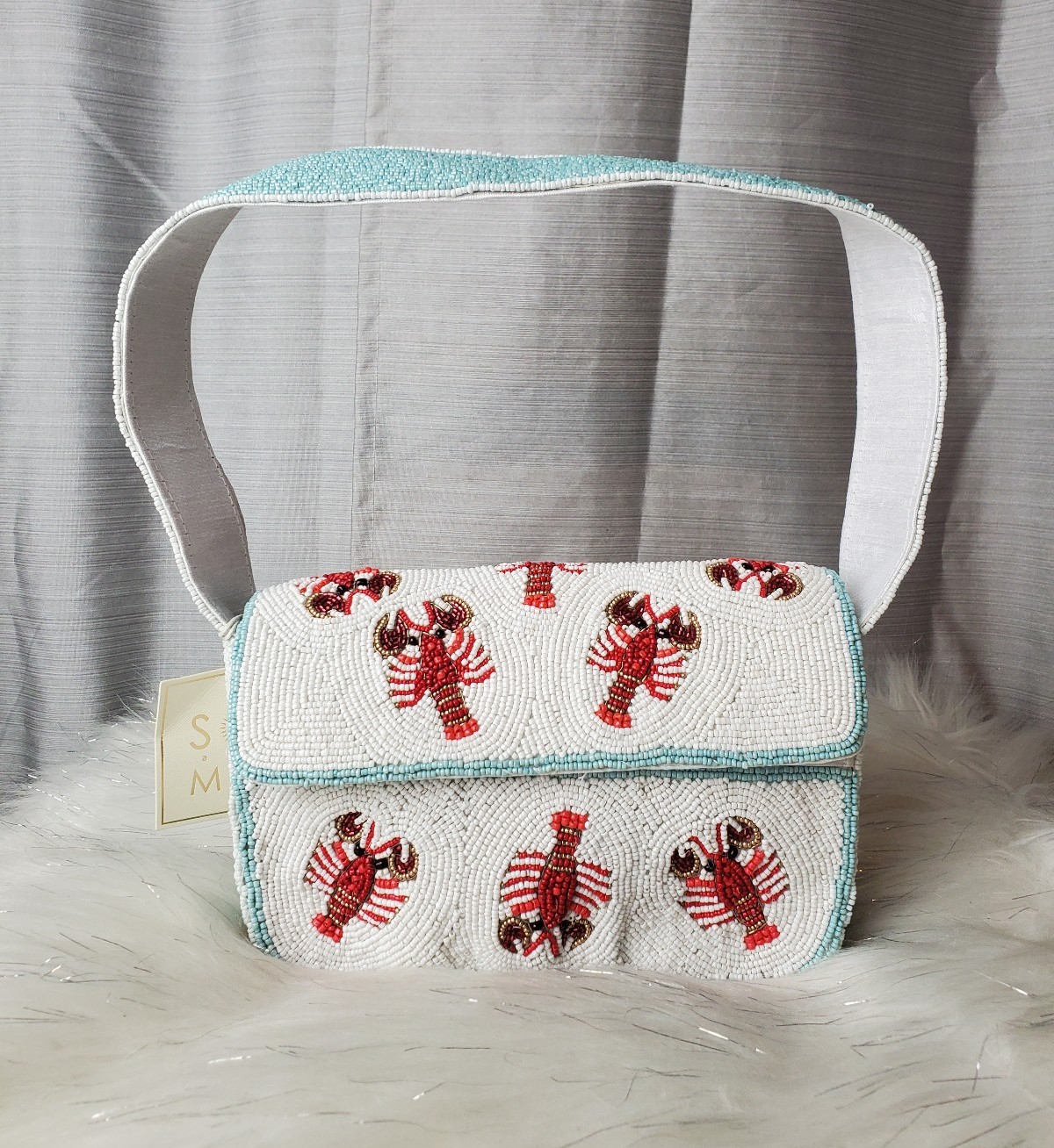 SOL AND MER viral lobster beaded bag