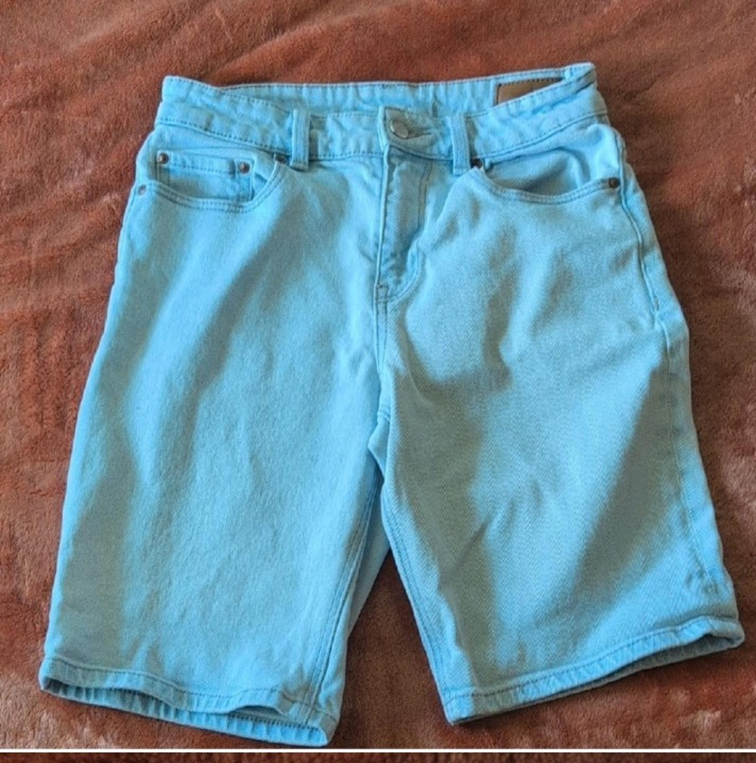 Stylish and comfortable men's blue shorts, perfect for casual outings.