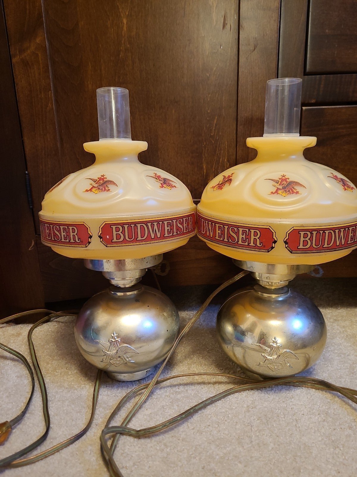 Two Budweiser wall lamps