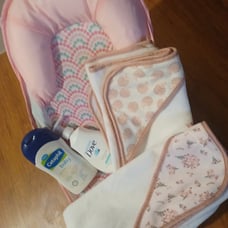 Babygirl bath seat with wash,lotion and towels Dove and Cetephil