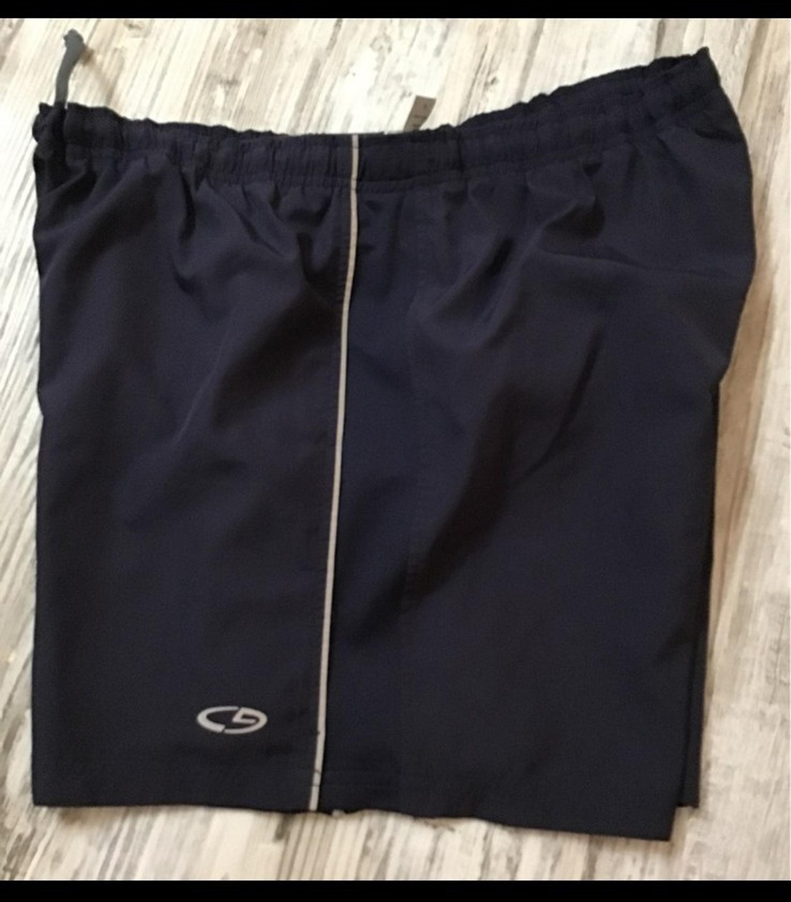 Champion brand athletic shorts and men's size, medium, black and white.