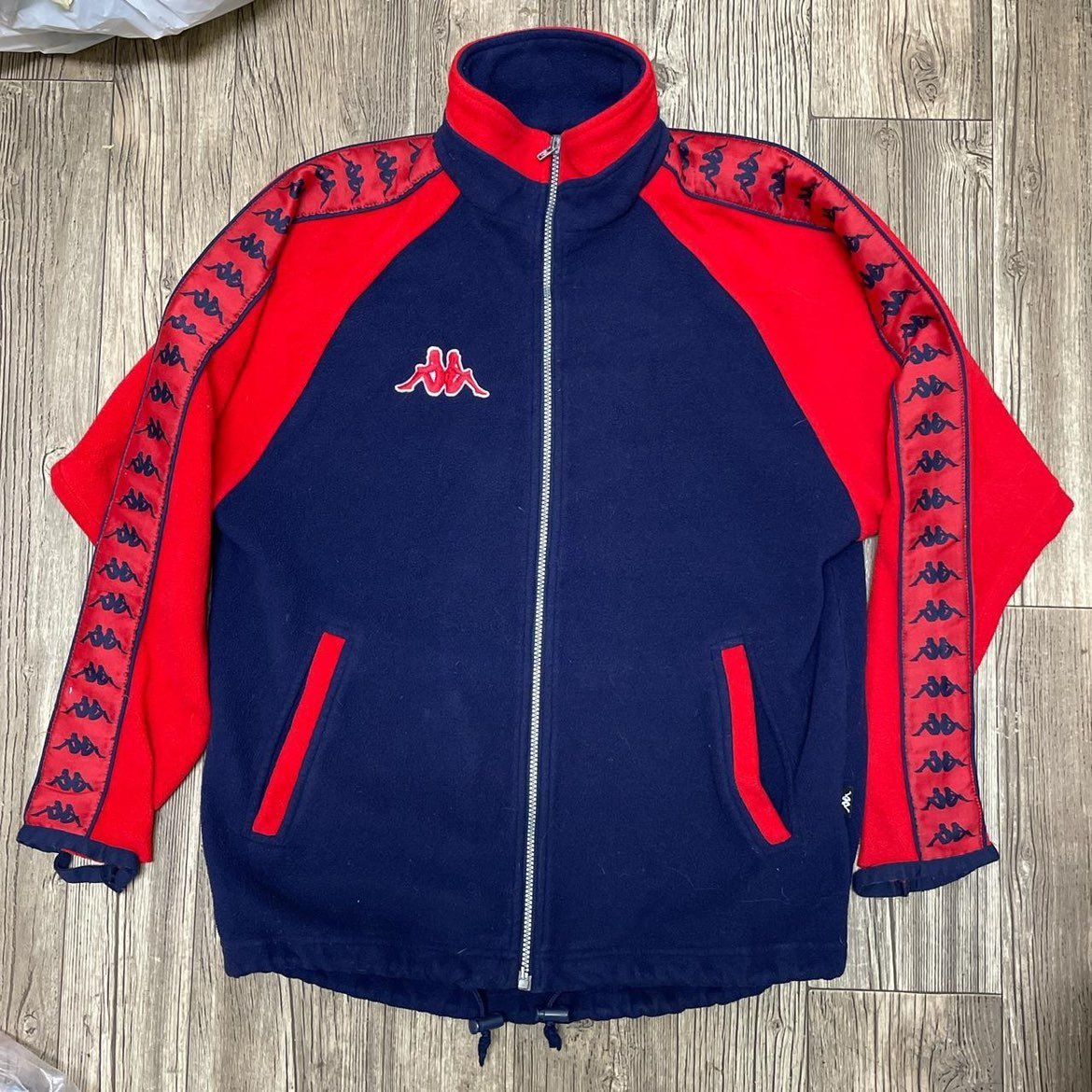 red and blue Kappa zip up
