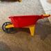 Kids toy wheel barrow red