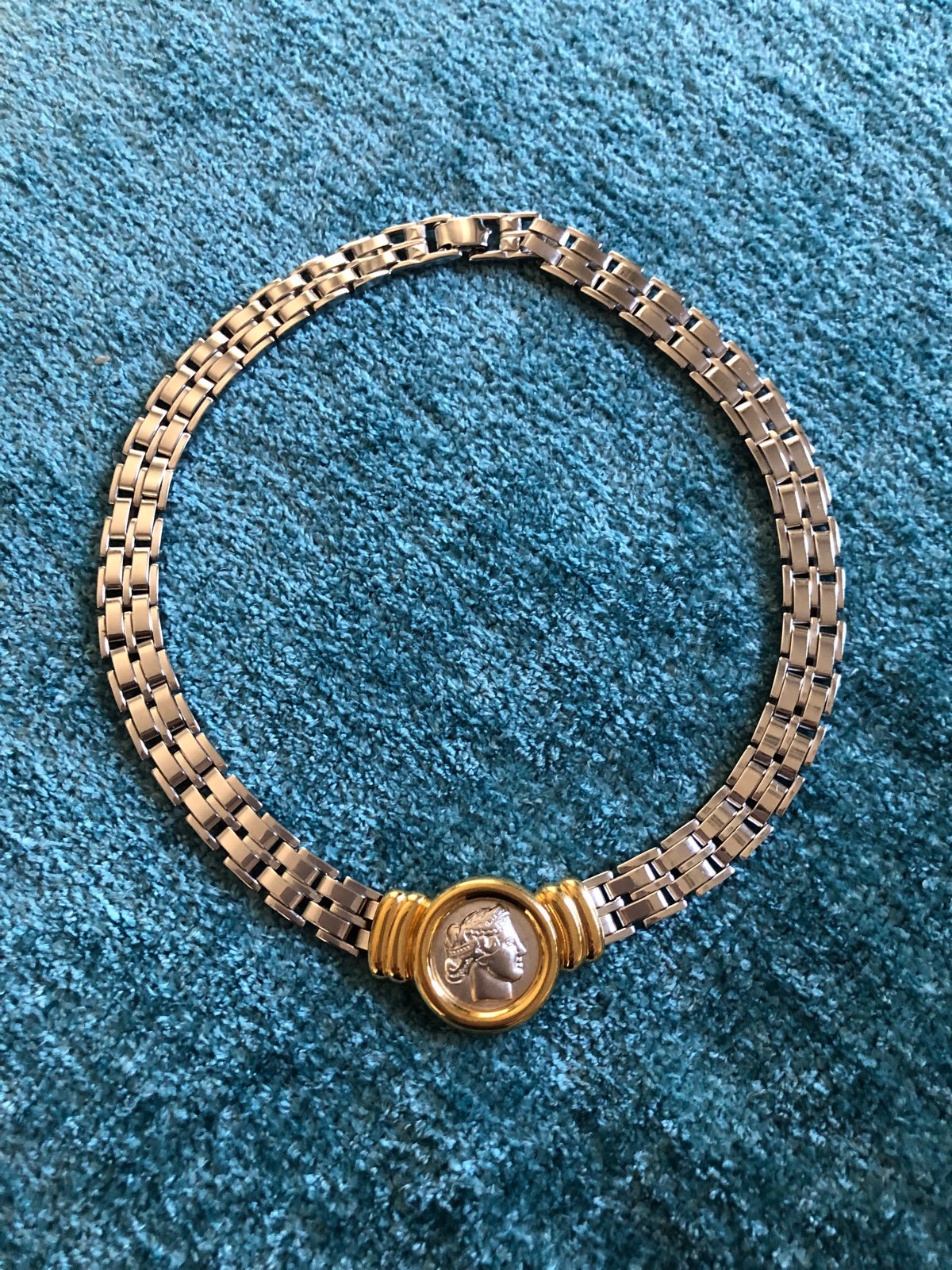 Monet Ventage necklace with coin emblem .