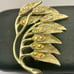 Vintage Gold Tone Leaf Brooch with Rhinestones and Intricate Branch Detailing