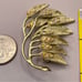 Vintage Gold Tone Leaf Brooch with Rhinestones and Intricate Branch Detailing