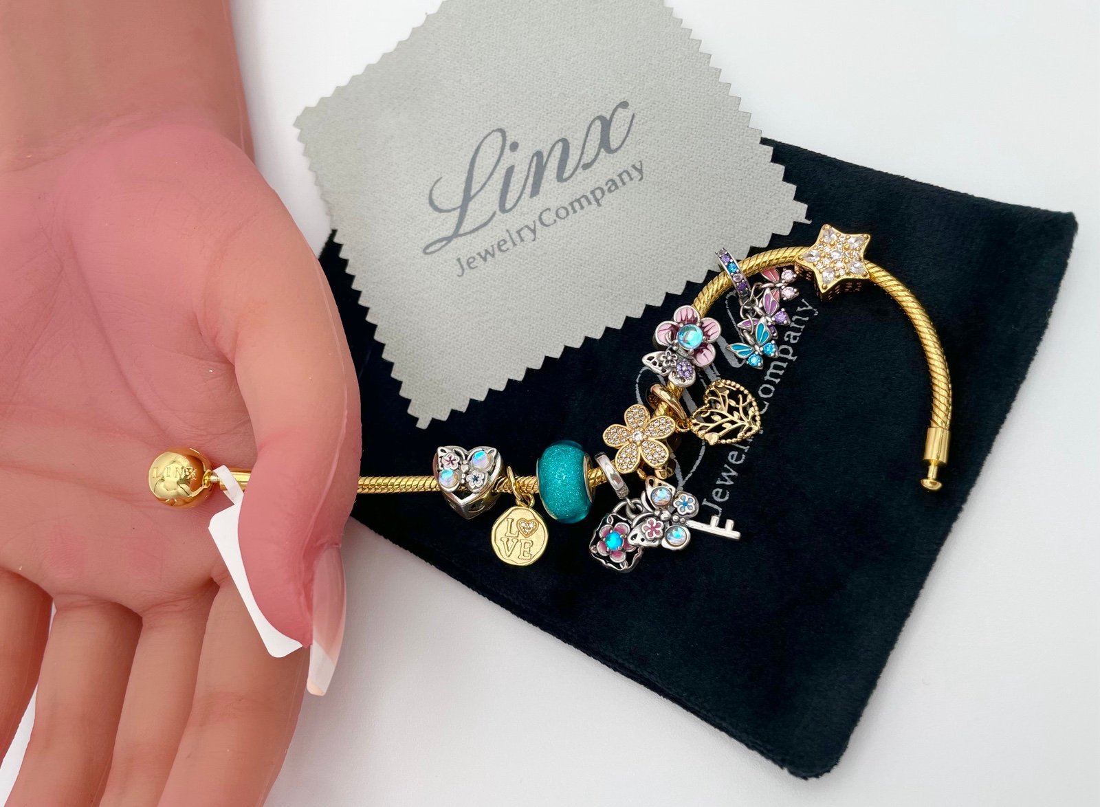 Linx Yellow Gold Bracelet with Gold Turquoise Pink and Silver Themed Charms