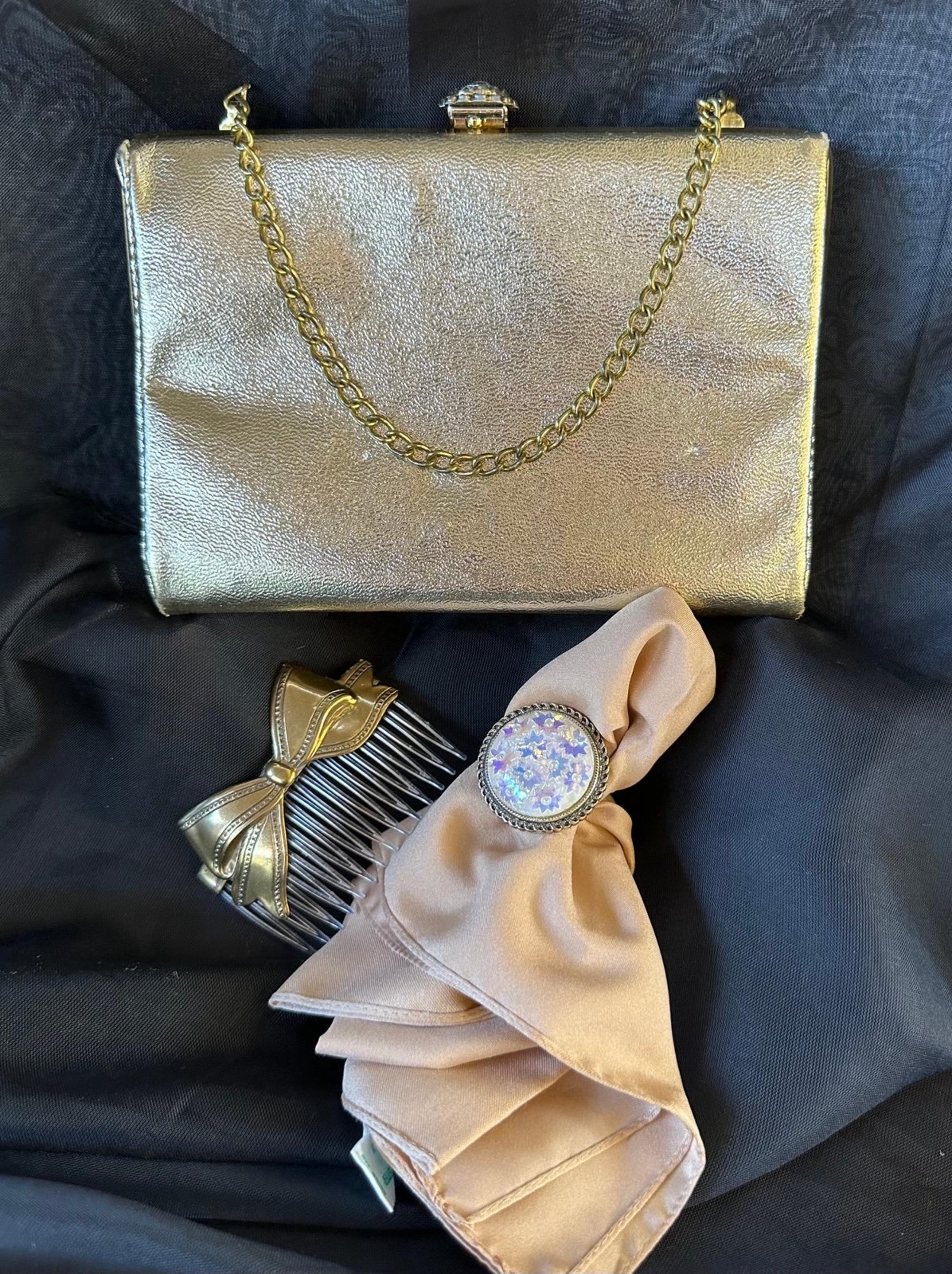 Clutch, hair comb, scarf and scarf clip