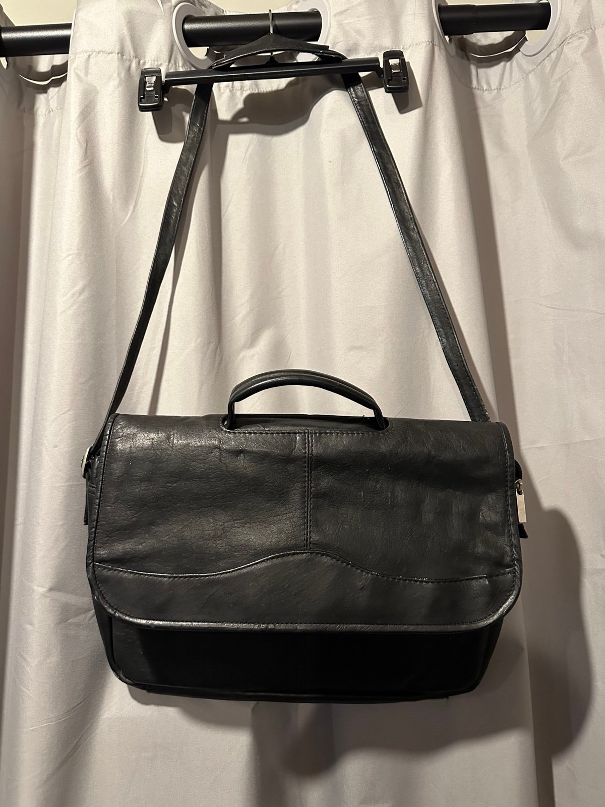 Leather over the shoulder briefcase. Very good condition.